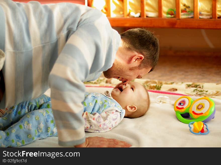 Father is with son to laugh, touched noses. Father is with son to laugh, touched noses