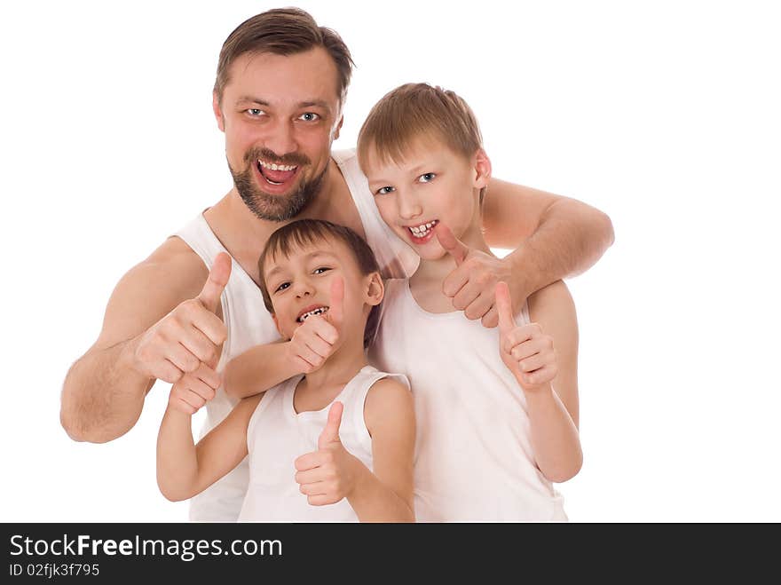 Young father with his two sons standing on a white background