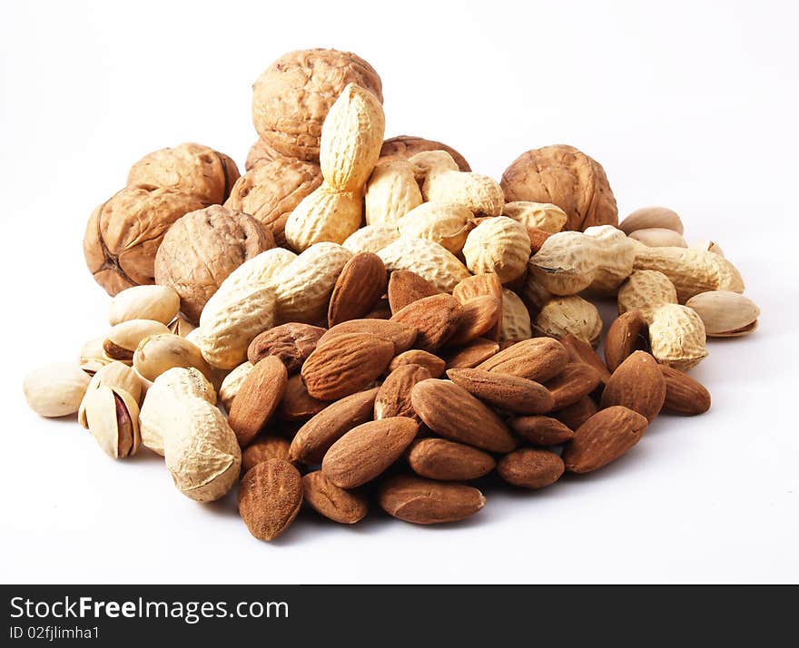 Peanuts, almonds, pistachios, walnuts on white background