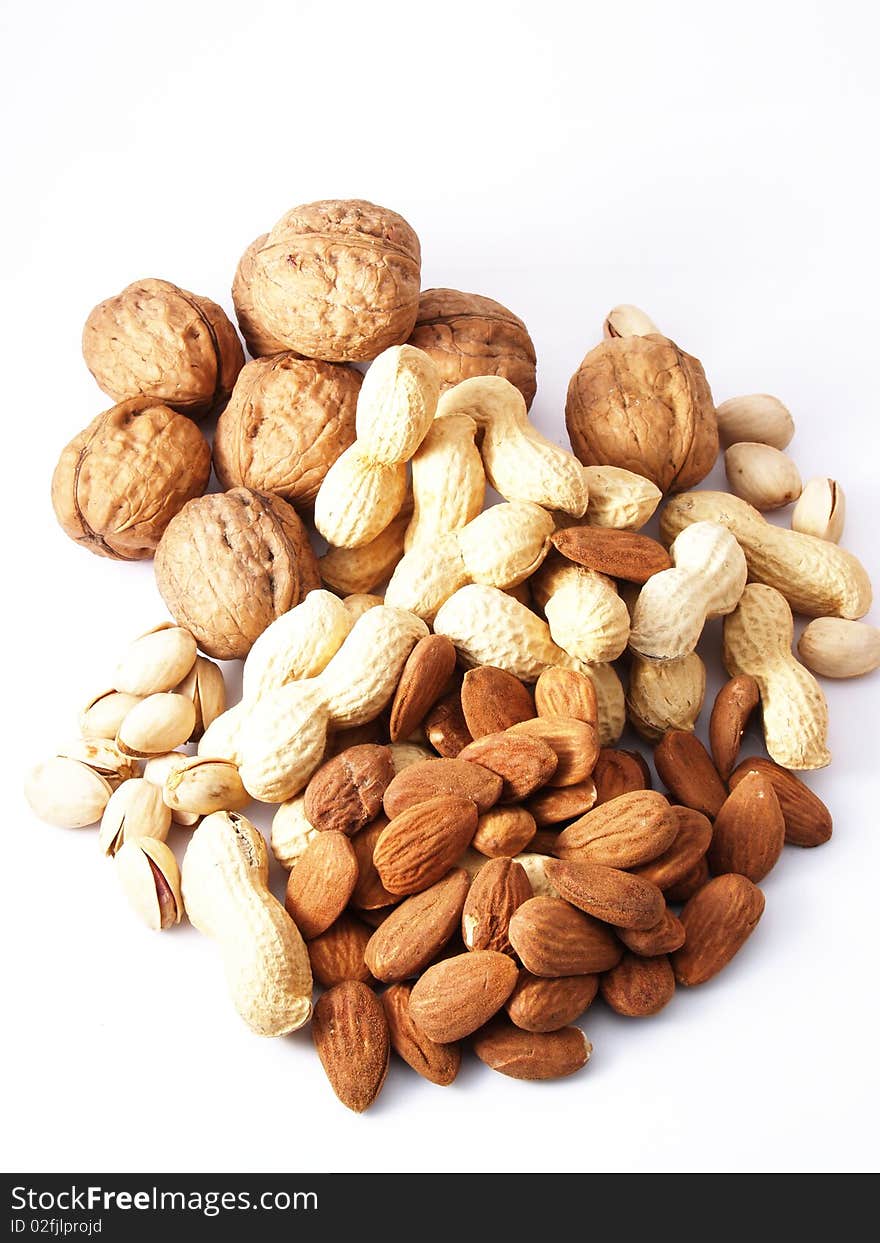 Peanuts, almonds, pistachios, walnuts on white background