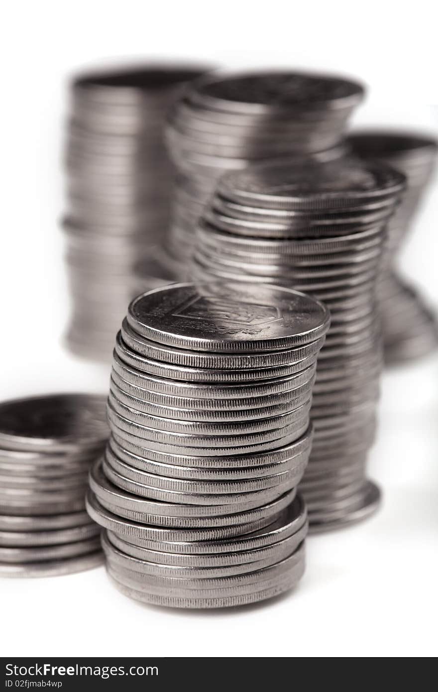 Stacks of coins on white backround