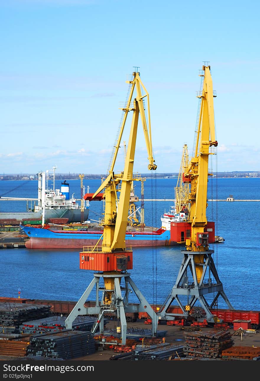 Two yellow lifting cranes