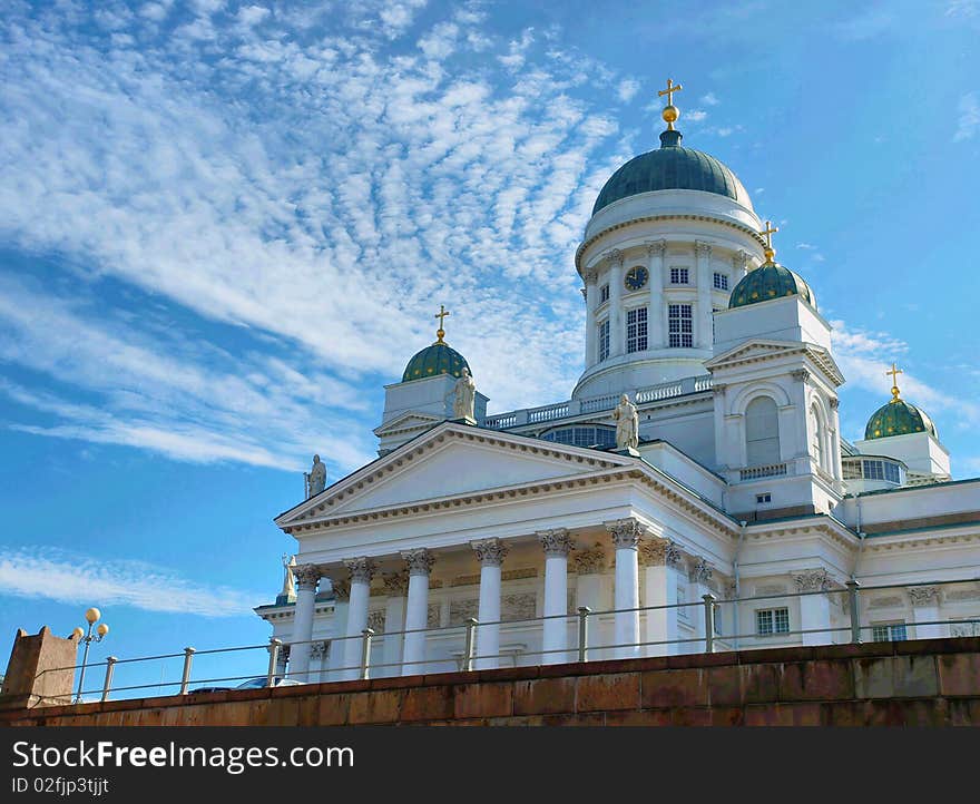 The Lutheran Cathedral in Helsinki. Blue ski and clouds in background