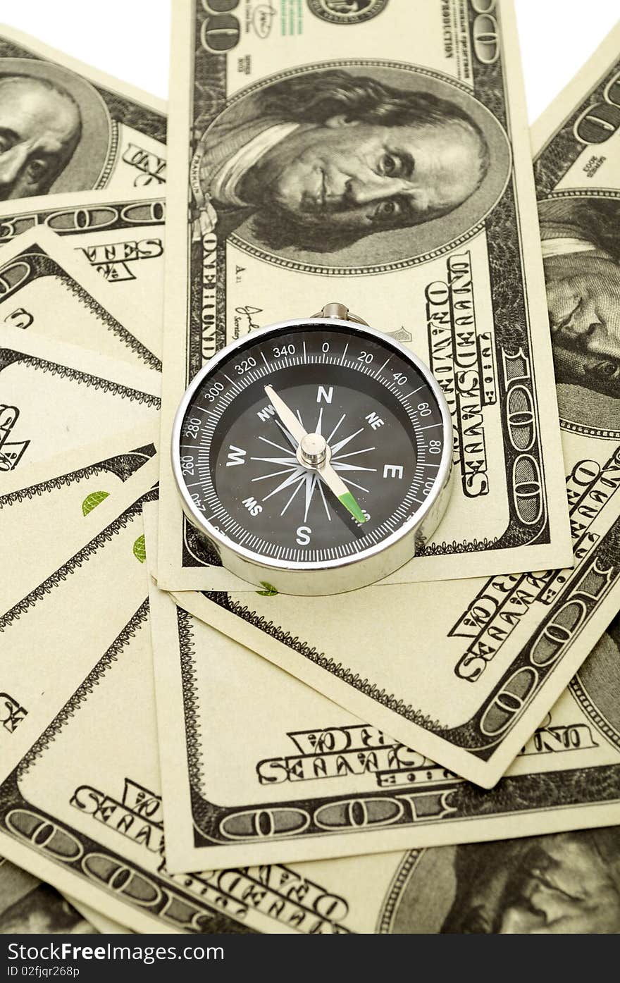 Compass on hundred dollar background