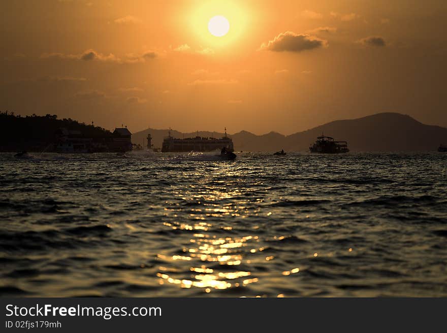 Sun go down between two islands