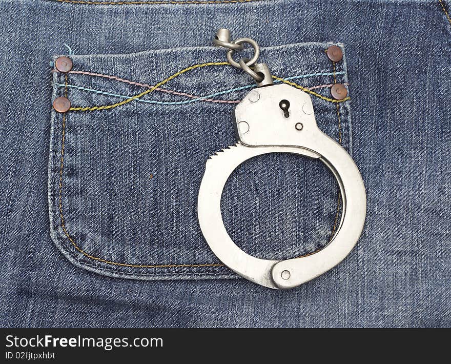 Handcuffs in jeans pocket