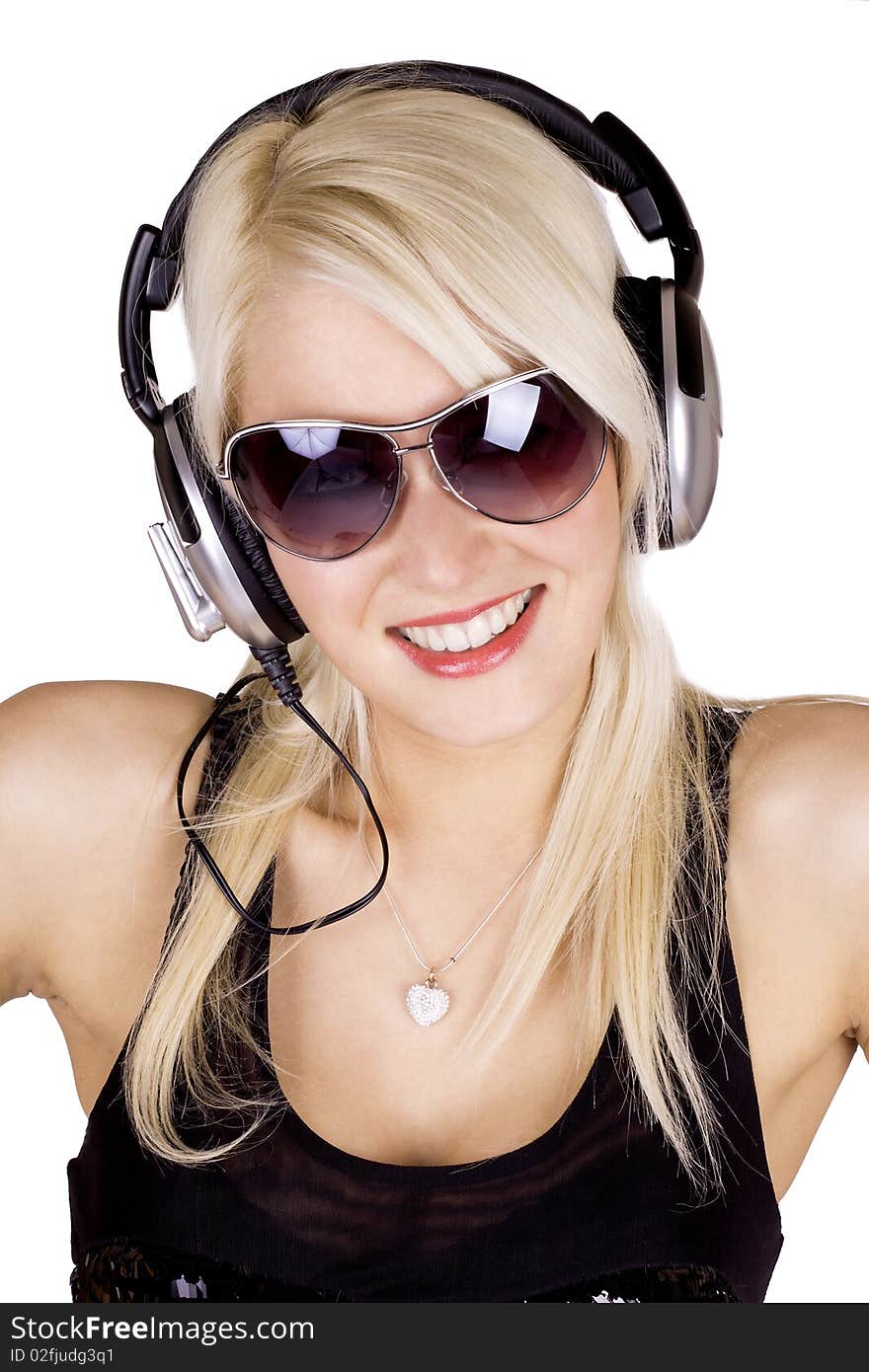 Blond girl listening to music wearing headphones