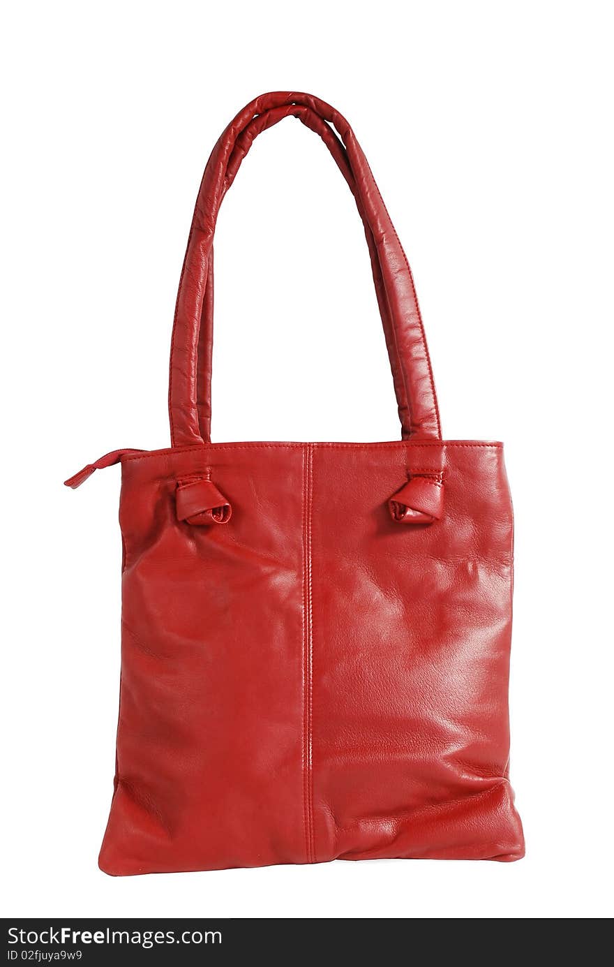 This is a beautiful red leather ladies handbag isolated on a white background.