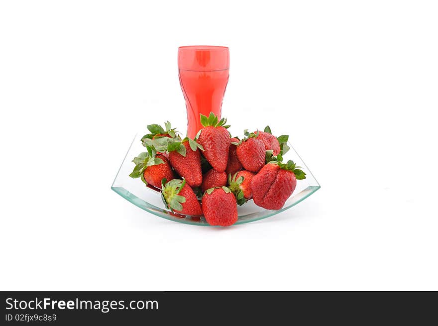 Strawberries and red glass of water. Strawberries and red glass of water