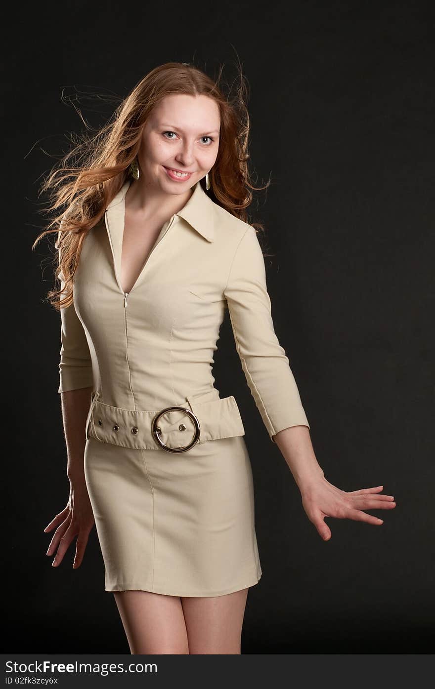 Young redhead girl posing in studio