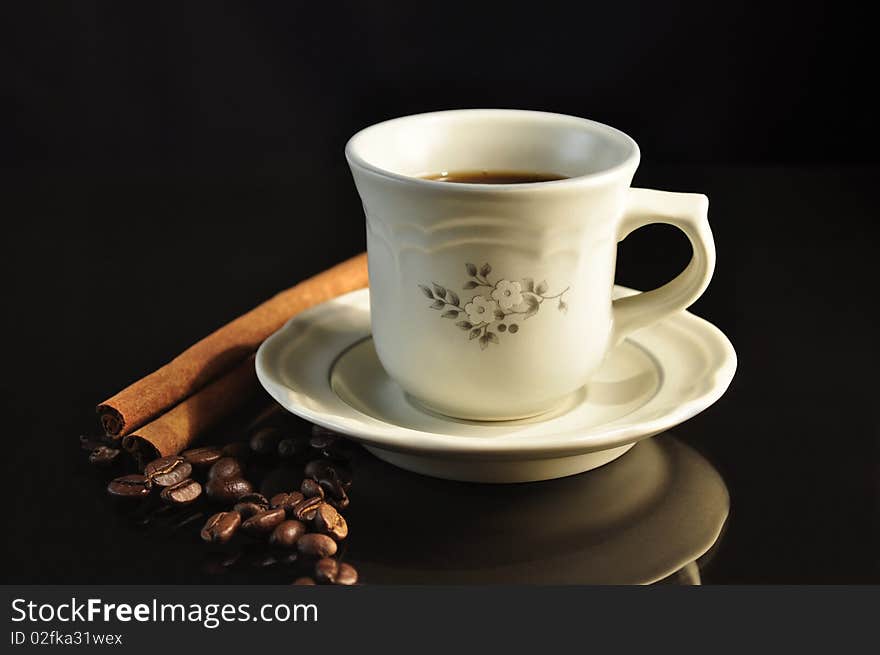 Cup of coffee on black background