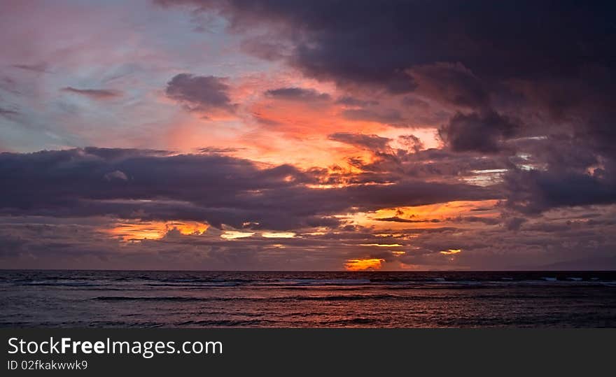 Beautiful fiery sunset on the sea in summer