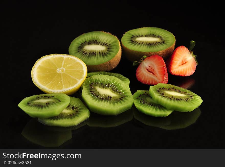 Fresh fruits on black background