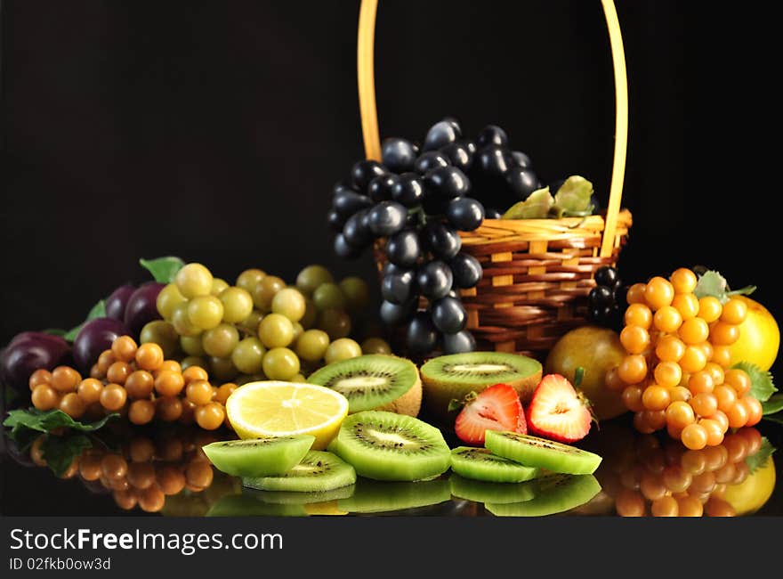 Fresh fruits on black background