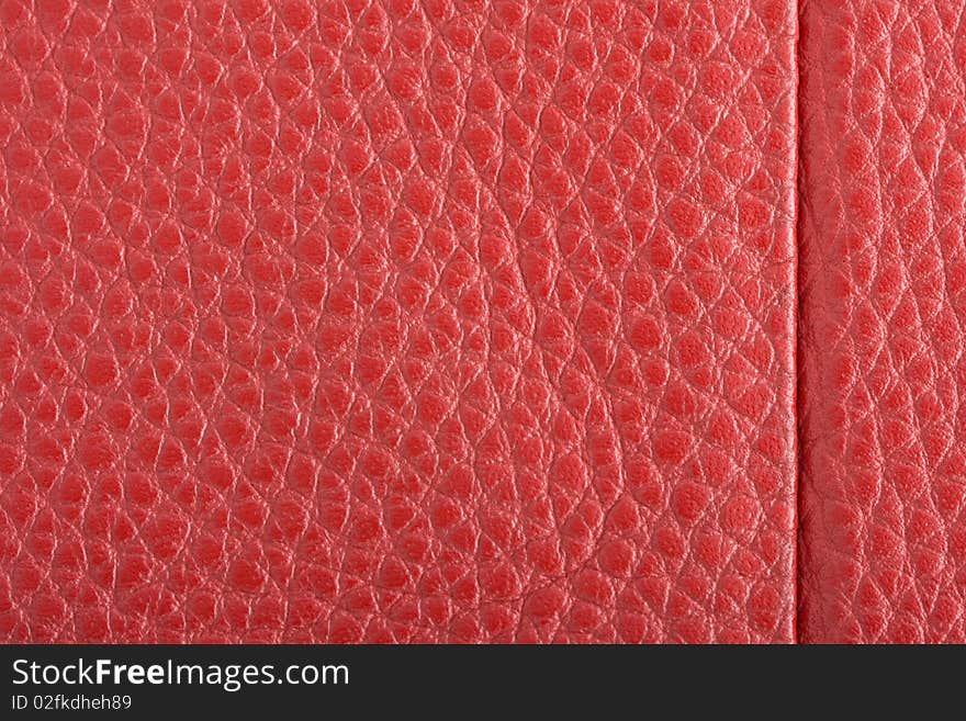 Fawn leather with red stitching.