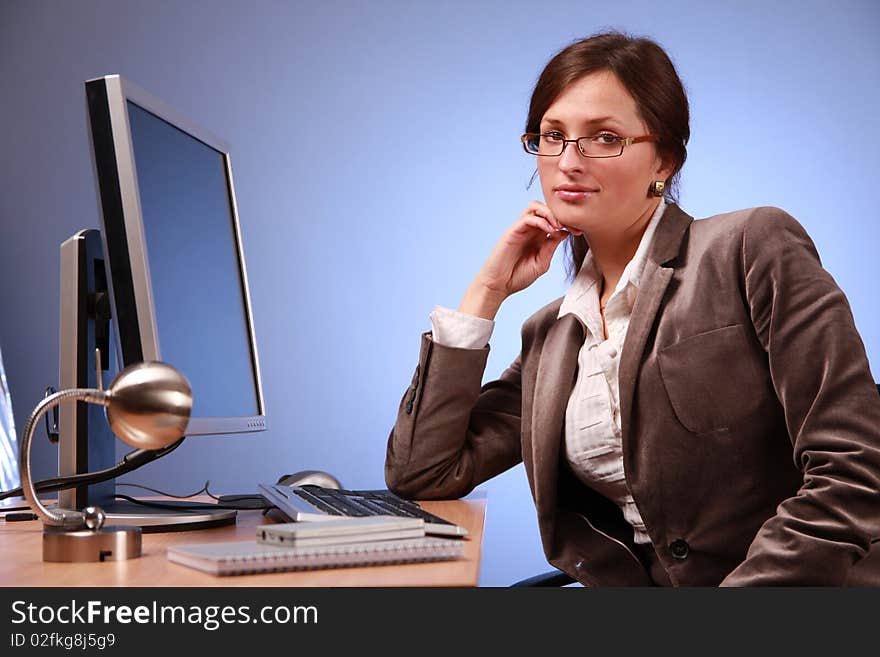 Young businesswoman working in office. Young businesswoman working in office