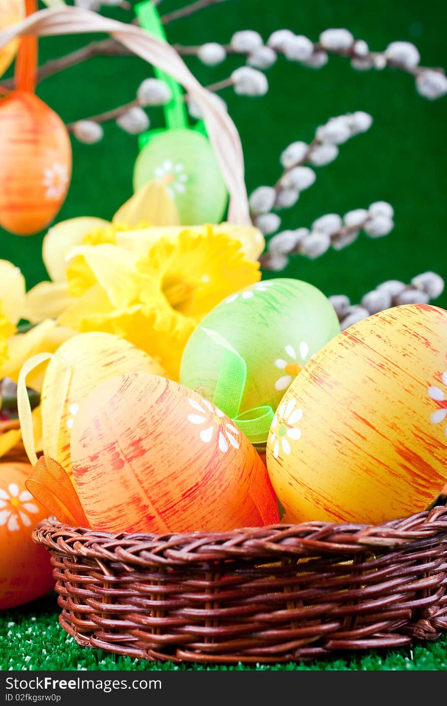 Close-up of easter eggs in nest and flowers. Close-up of easter eggs in nest and flowers