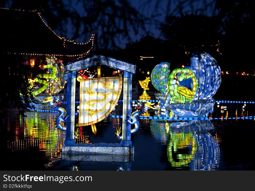 Colorfull artefacts for a chinese festival with reflection on water