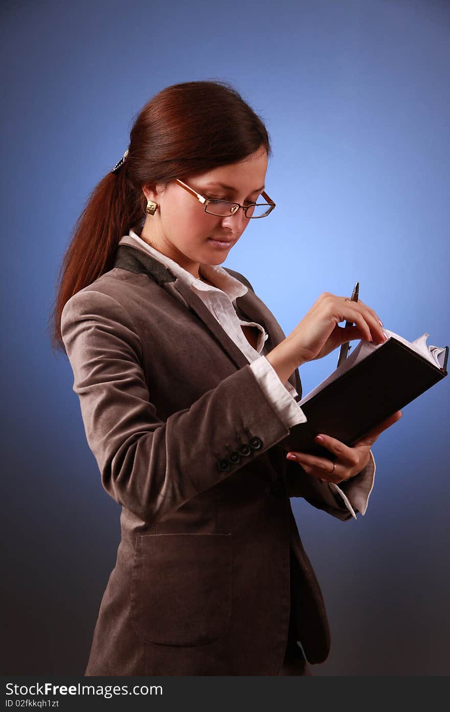 Beautiful business-woman with organizer. Beautiful business-woman with organizer