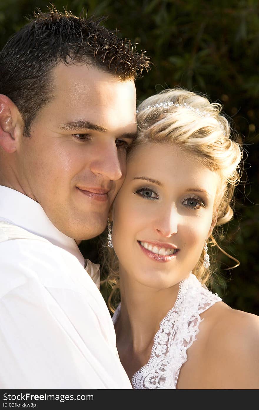 Beautiful bridal couple outdoors on their wedding day