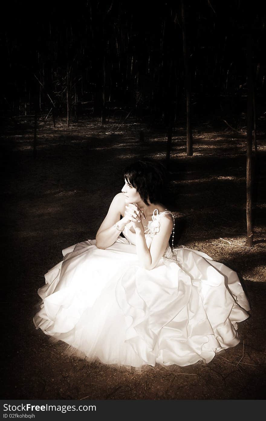 Beautiful brunette bride with short hair and white gown