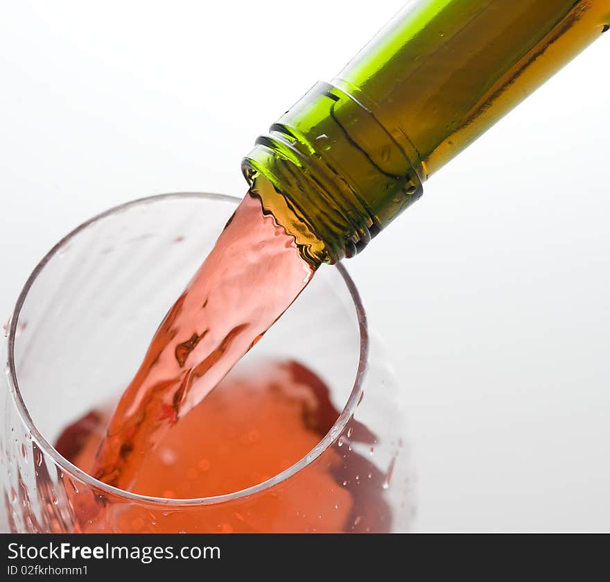 Red wine and bottle isolated on white