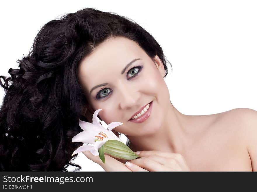 Beautiful woman with a lily flower on a white background. Beautiful woman with a lily flower on a white background