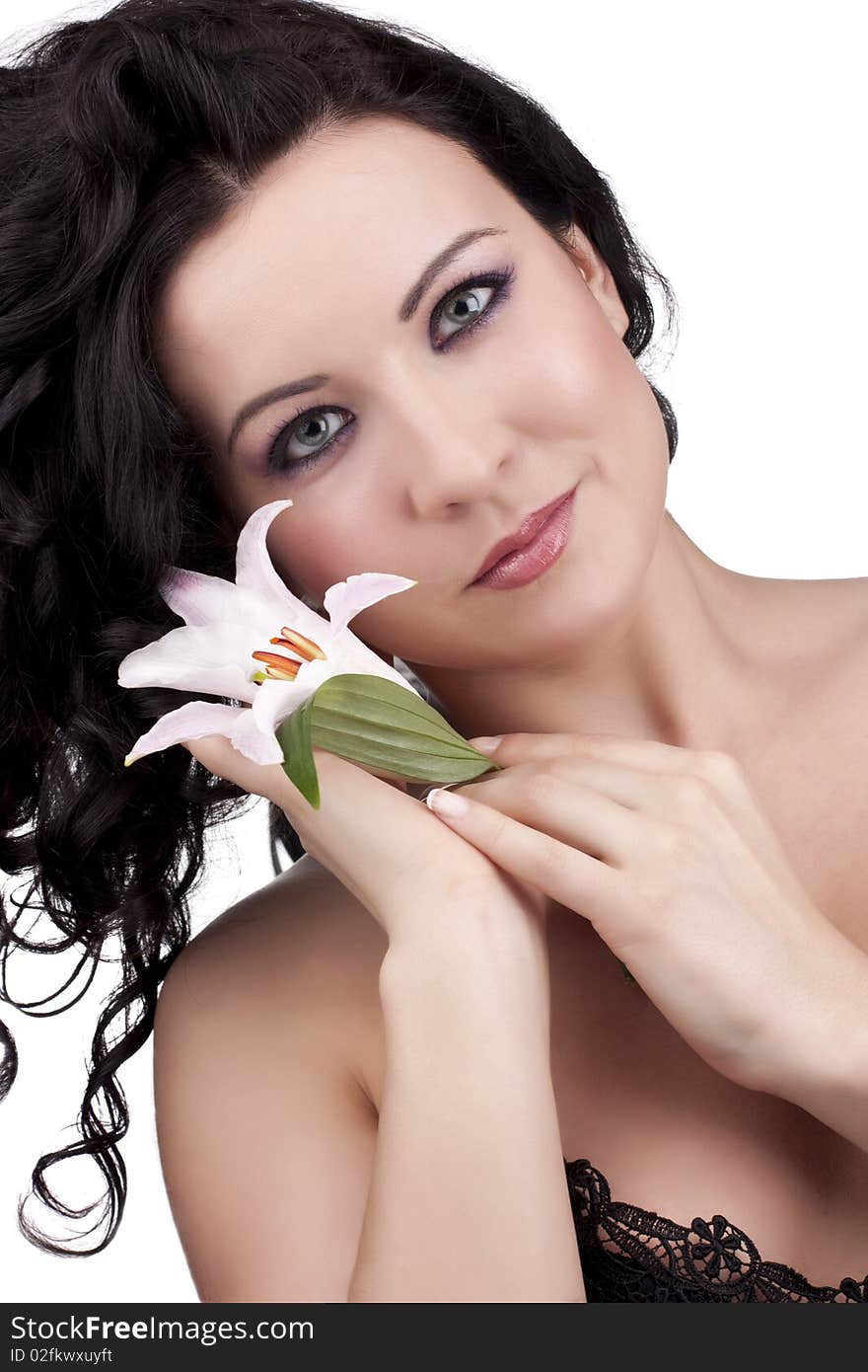 Beautiful woman with a lily flower on a white background. Beautiful woman with a lily flower on a white background