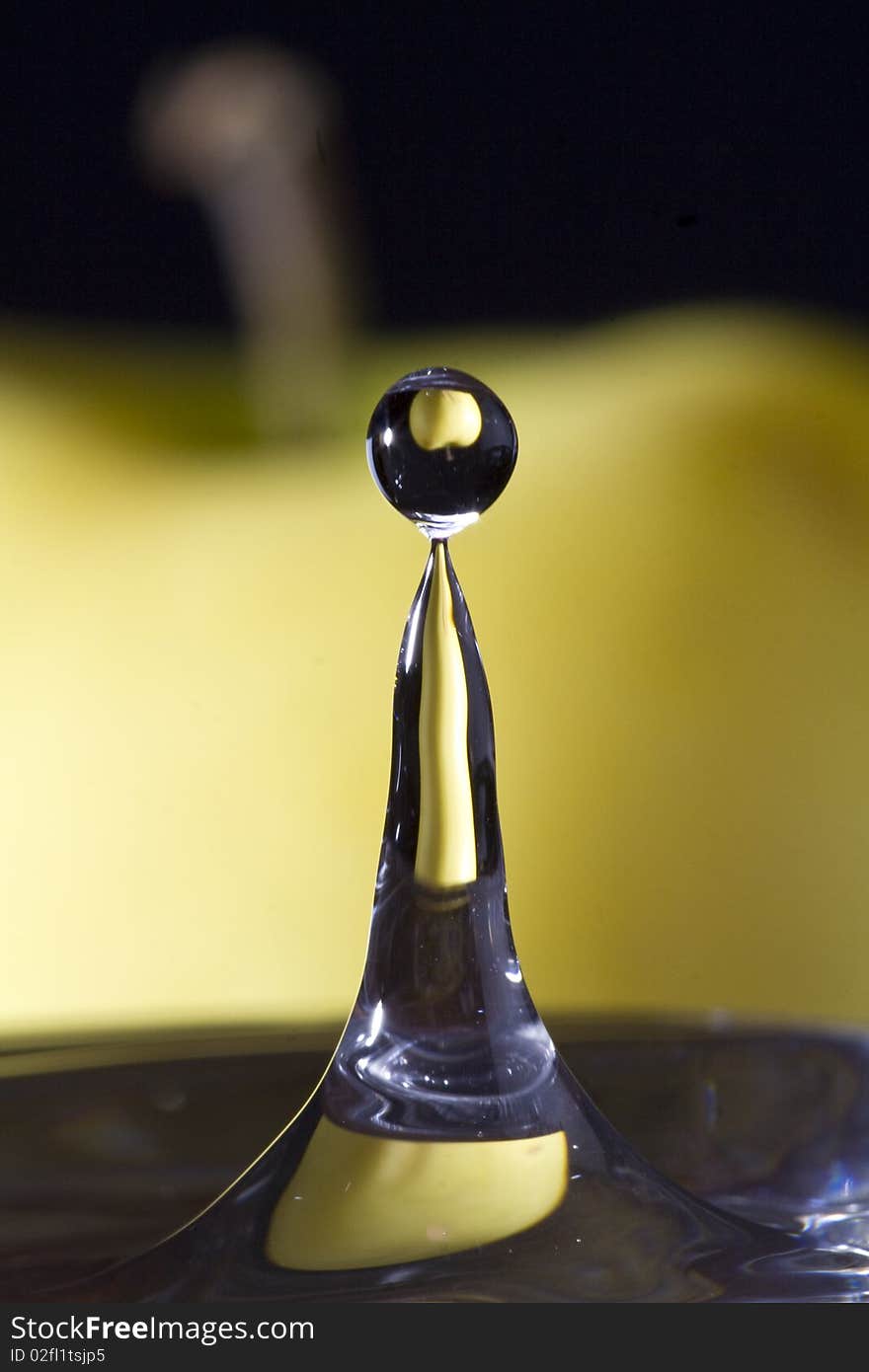 Water drop with apple reflection