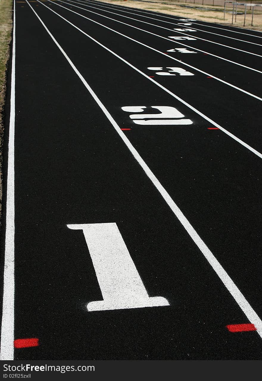 Vertical view of lanes 1 through 8 on school track field. Vertical view of lanes 1 through 8 on school track field.