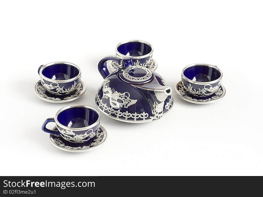 Four mugs a teapot for tea. Four mugs a teapot for tea