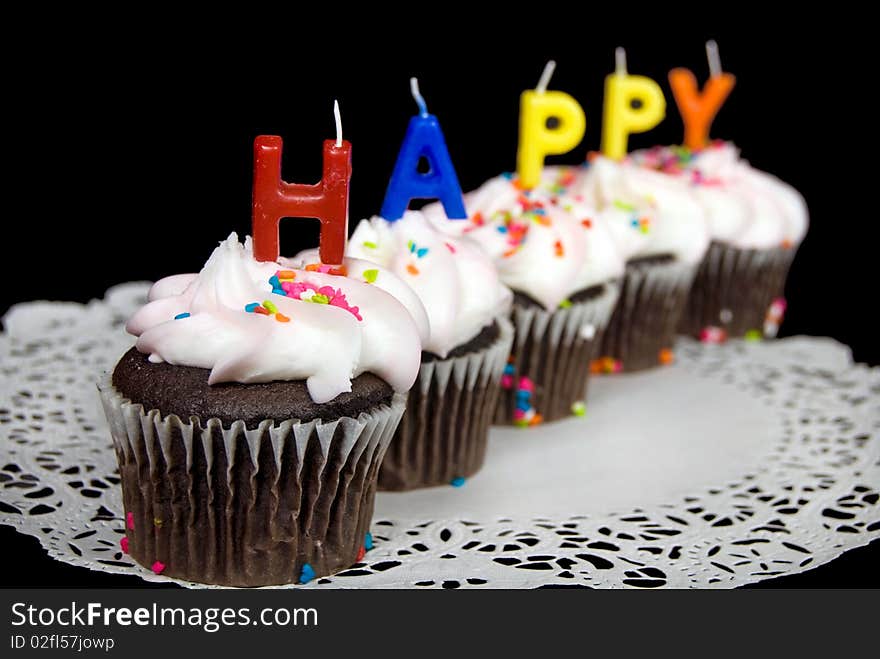 Row of chocolate cupcakes for birthday. Row of chocolate cupcakes for birthday.