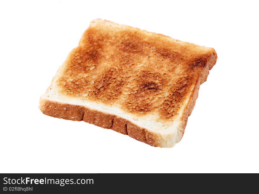 A piece of baked bread isolated on white background.