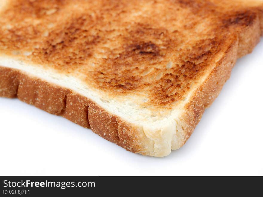 A piece of baked bread isolated on white background.