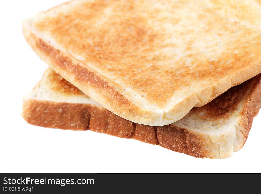 Two pieces of baked bread isolated on white background. Two pieces of baked bread isolated on white background.