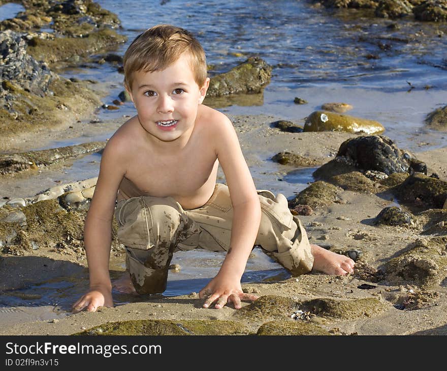 Boy is playing at the beach. Boy is playing at the beach