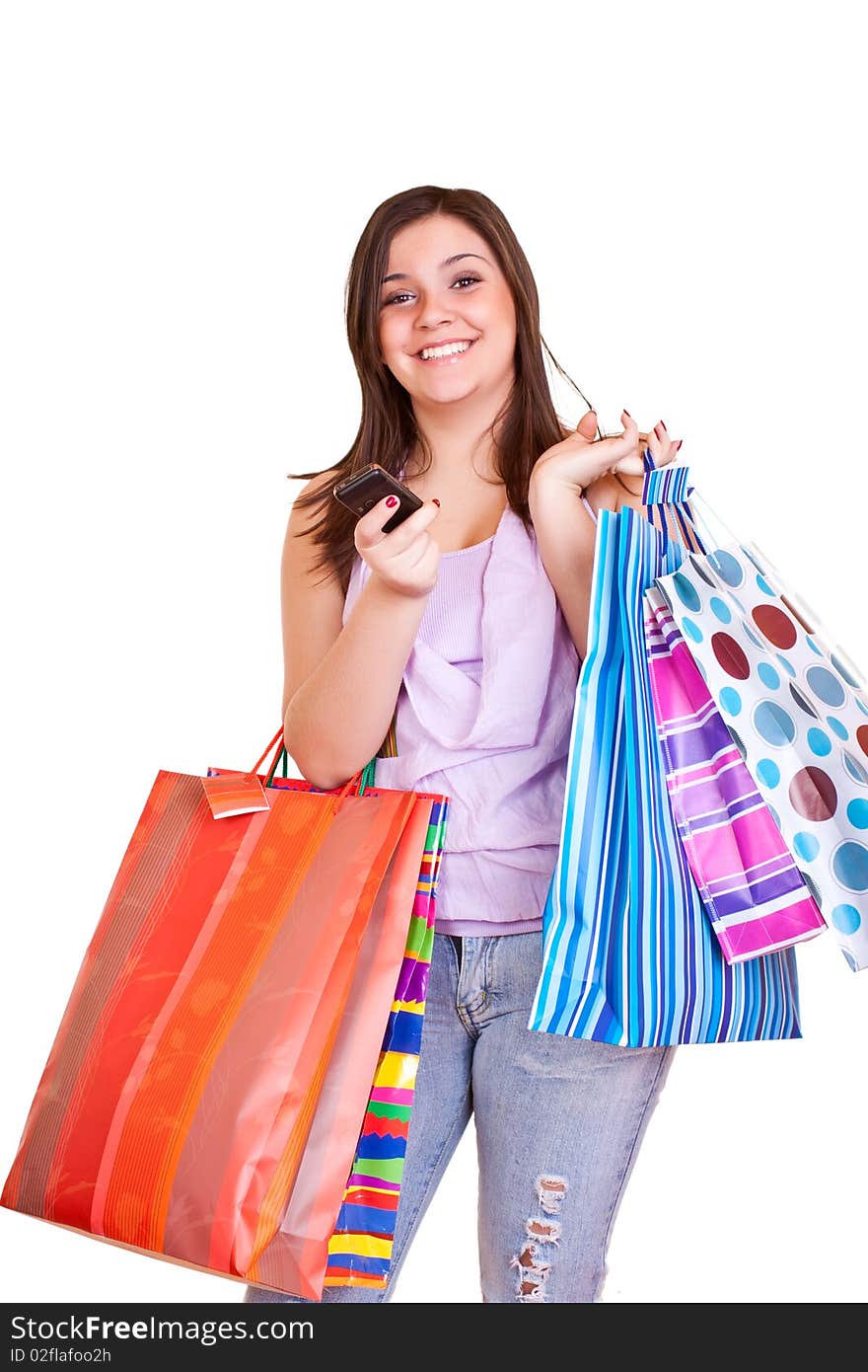 Happy  Girl Holding Shopping Bags And Cell Phone