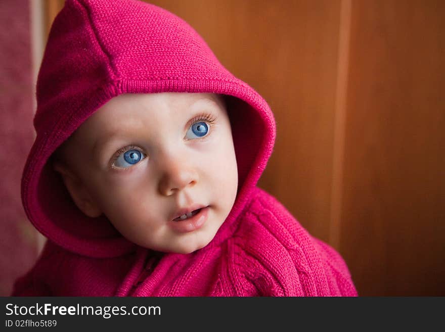 Portrait of amazed beautiful child in stripe cap