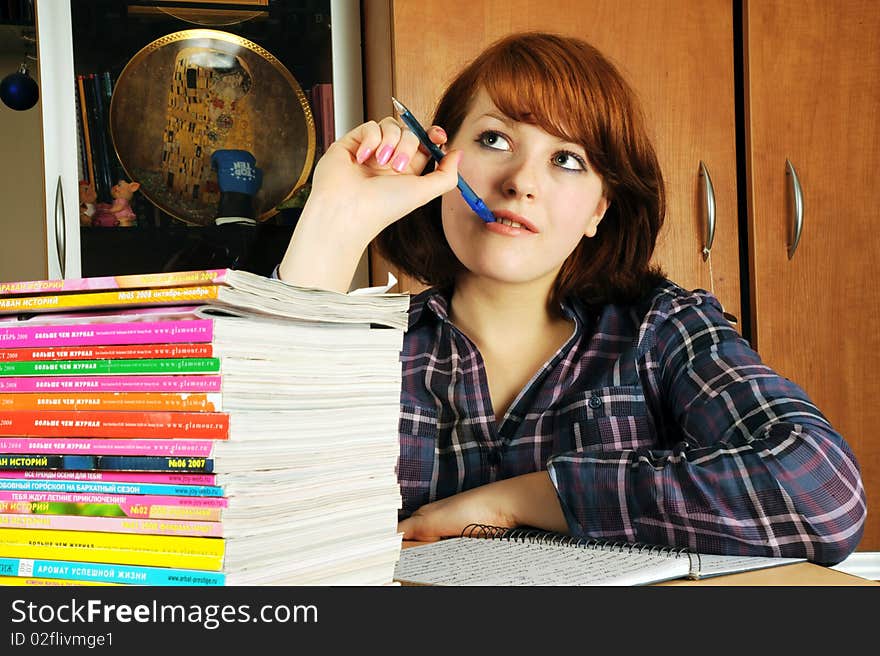 The young girl the student does a homework