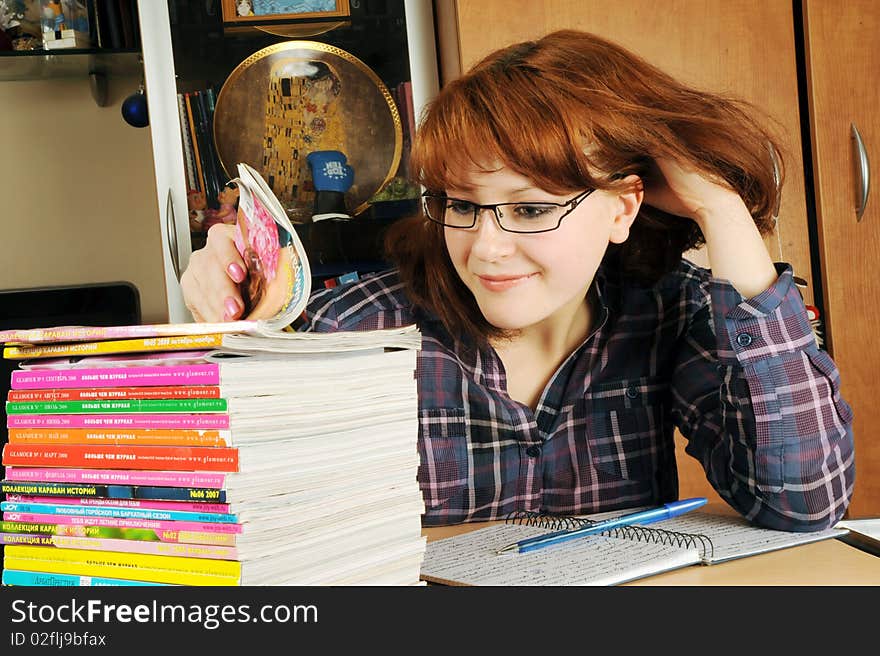 The young girl the student does a homework