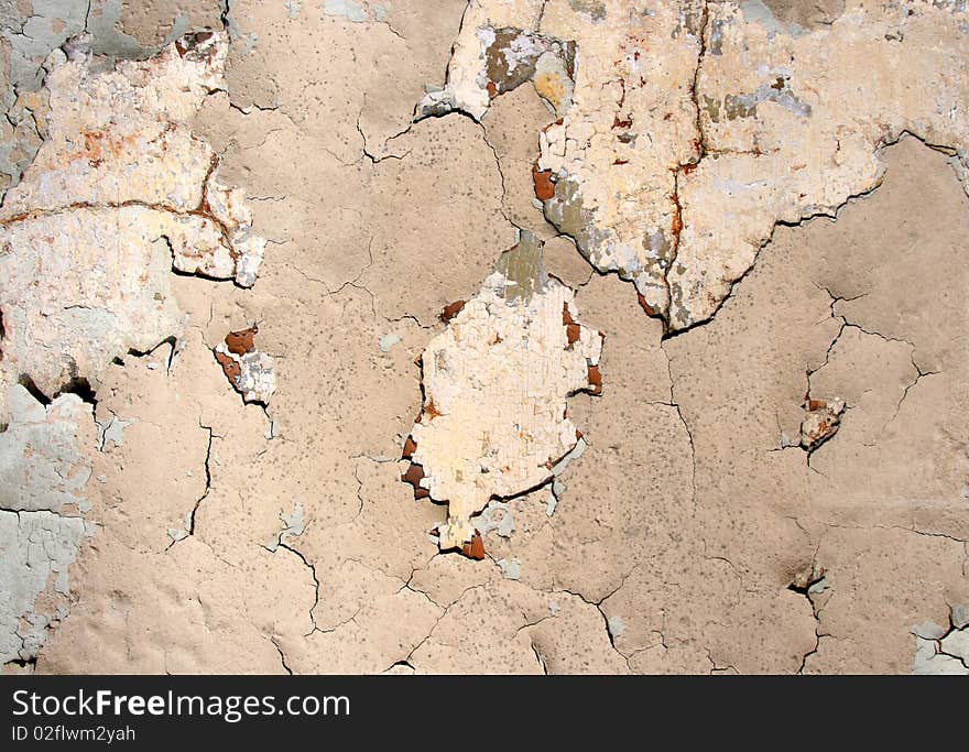 Grunge scratched texture / background on a cracked stone wall. Grunge scratched texture / background on a cracked stone wall.