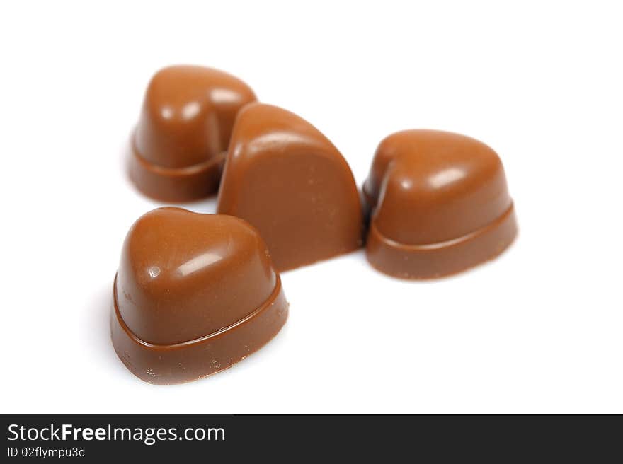 Delicious background of swiss dark chocolates, milk chocolates, pralines and truffles