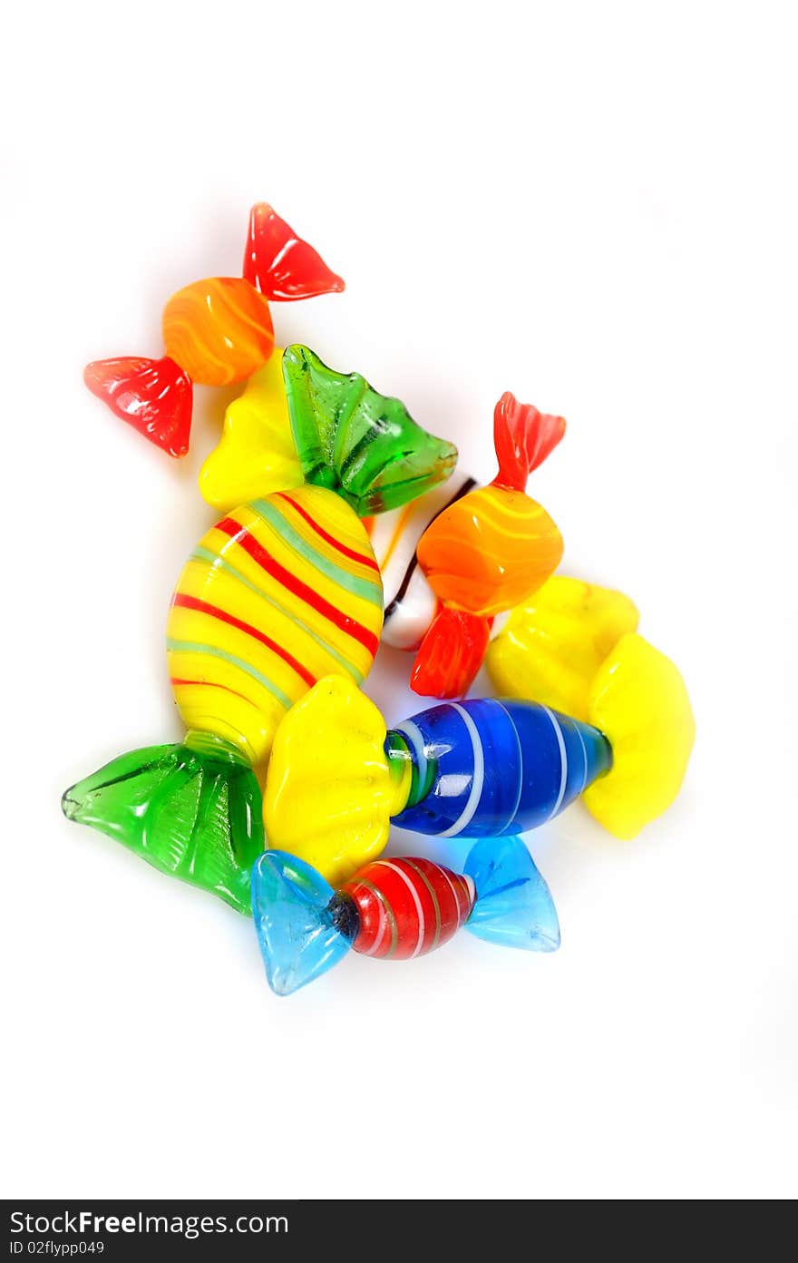 Delicious multi colored candies on white background