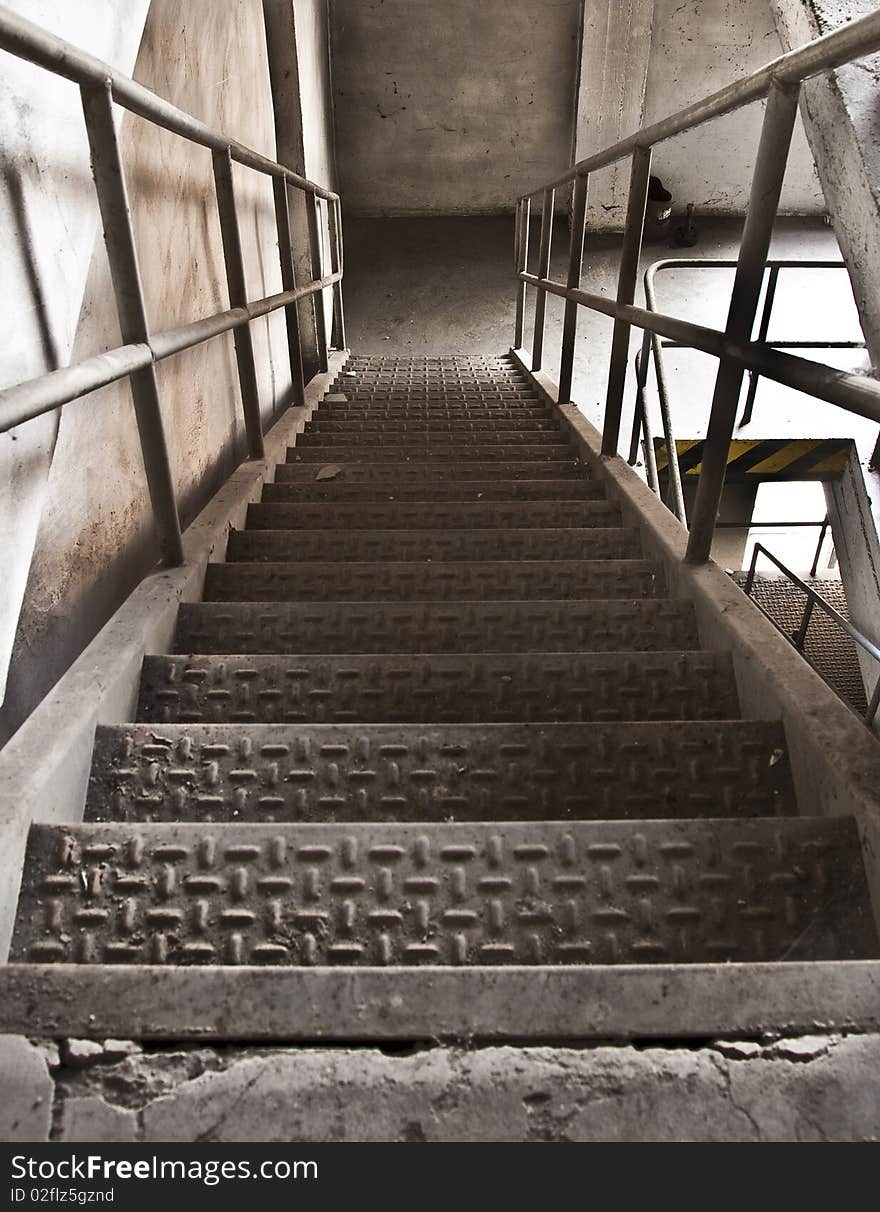 A metal staircase at an abandoned factory. A metal staircase at an abandoned factory