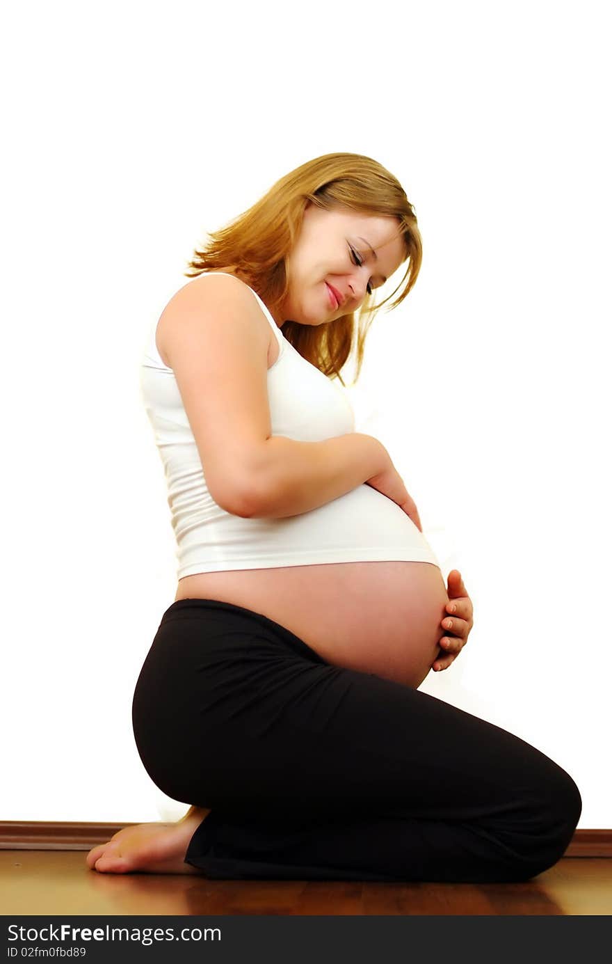 Pregnant woman against white background