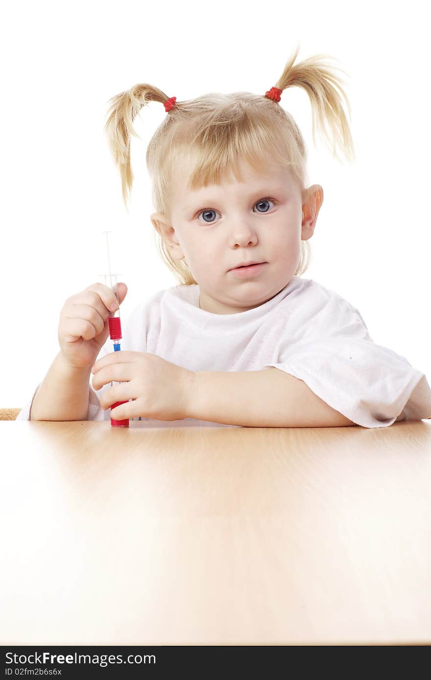 Child playing as a doctor with syringe. Child playing as a doctor with syringe