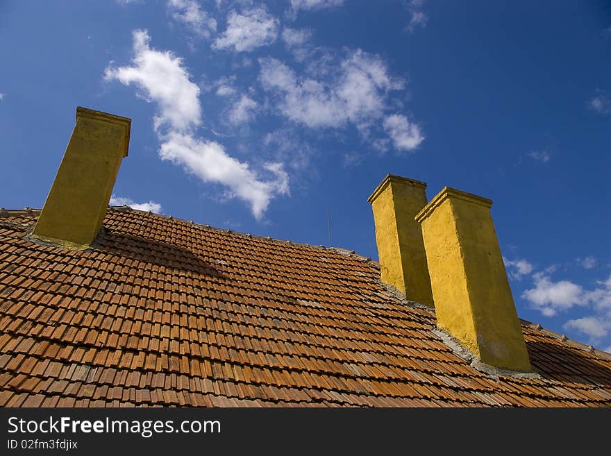 Three Chimneys On Rooftop