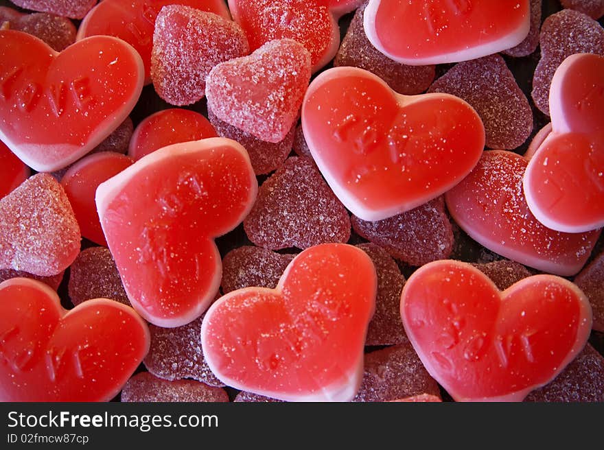 Close-up background made of red heart-shaped candies