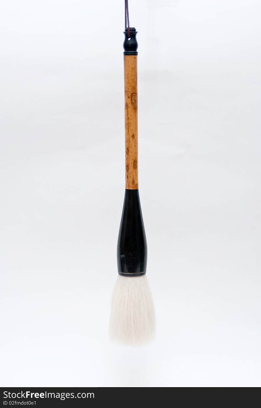 Chinese inkpainting brush with hair for the brush and bamboo for the handle. Chinese inkpainting brush with hair for the brush and bamboo for the handle