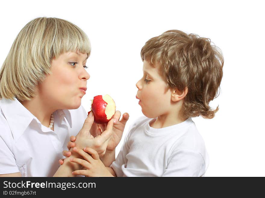 Woman and little boy playing and eating an apple. Woman and little boy playing and eating an apple